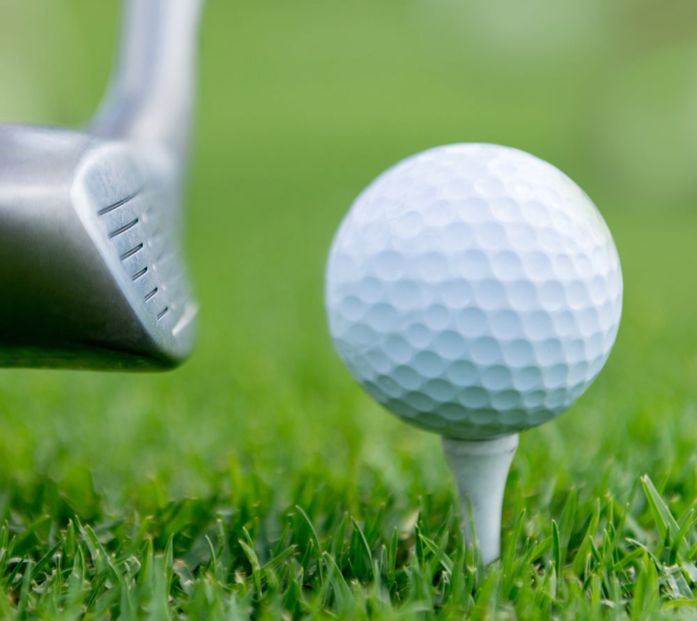 White golf ball at the tee box